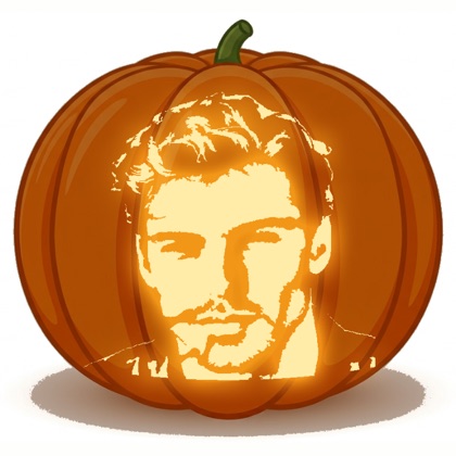 The finished two-tone design shown lit on a pumpkin